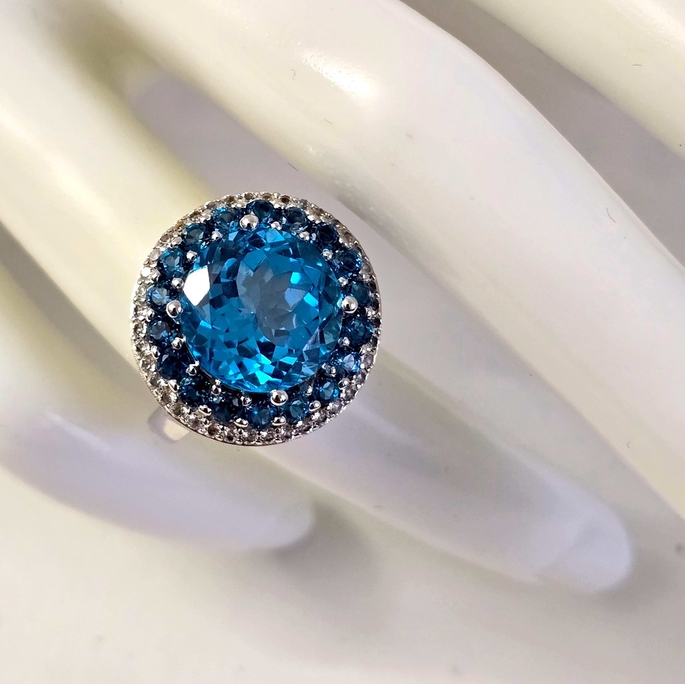 Sterling Silver 925 Elegant Blue Topaz Ring with Halo Design